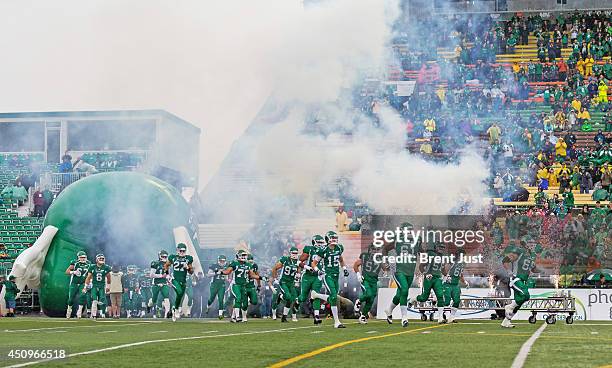 The Saskatchewan Roughriders take the field for a pre-season game between the Edmonton Eskimos and Saskatchewan Roughriders at Mosaic Stadium on June...