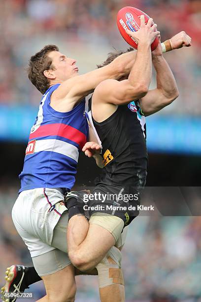 Dale Morris of the Bulldogs spoils a mark by Sam Gray of the Power during the round 14 AFL match between the Port Adelaide Power and the Western...