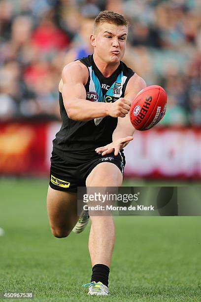 Ollie Wines of the Power passes the ball during the round 14 AFL match between the Port Adelaide Power and the Western Bulldogs at Adelaide Oval on...