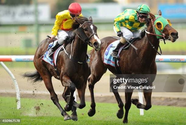 Michelle Payne riding Street Allure defeats Kayla Nisbet riding Longchamp Belle in Race 4, the Euroze Handicap during Melbourne racing at Moonee...