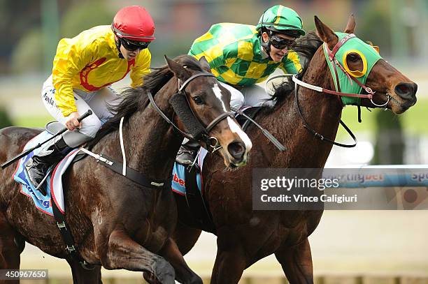 Michelle Payne riding Street Allure defeats Kayla Nisbet riding Longchamp Belle in Race 4, the Euroze Handicap during Melbourne racing at Moonee...