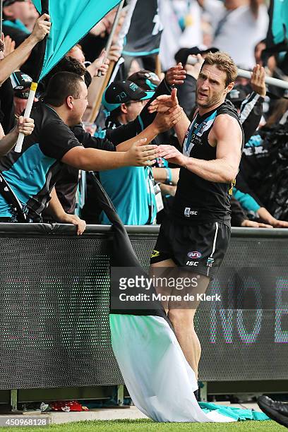 Jay Schulz of the Power celebrates with fans after he kicked a goal during the round 14 AFL match between the Port Adelaide Power and the Western...