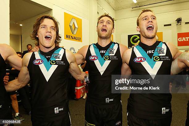 Jared Polec, Jay Schulz and Jack Hombsch of the Power celebrate after during the round 14 AFL match between the Port Adelaide Power and the Western...