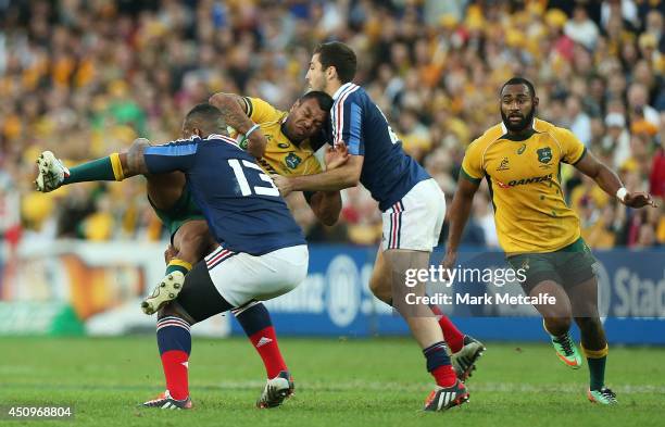 Kurtley Beale of the Wallabies is tackled by Mathieu Bastareaud of France during the International Test match between the Australia Wallabies and...