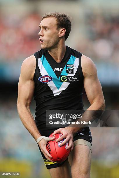 Jack Hombsch of the Power runs with the ball during the round 14 AFL match between the Port Adelaide Power and the Western Bulldogs at Adelaide Oval...