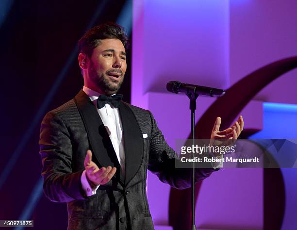Miguel Poveda performs on stage during the Onda Awards 2013 Gala at the Gran Teatre del Liceu on November 20, 2013 in Barcelona, Spain.