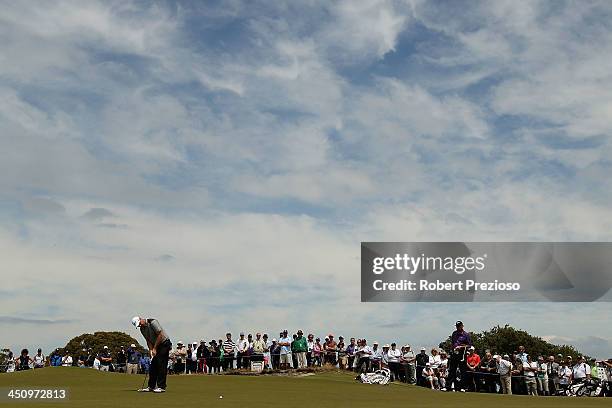 Peter Hanson of Sweden putts on the 5th hole during day one of the World Cup of Golf at Royal Melbourne Golf Course on November 21, 2013 in...