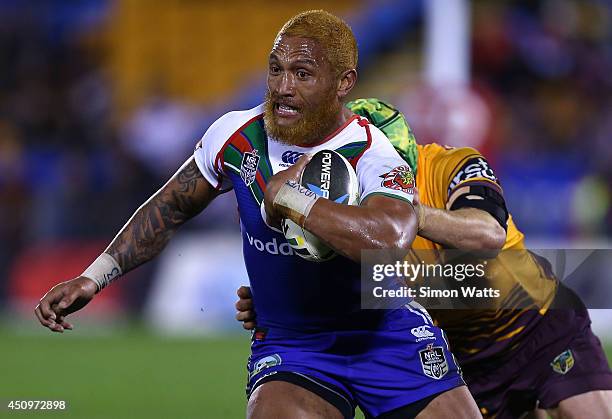 Manu Vatuvei of the Warriors beats the tackle of Todd Lowrie of the Broncos during the round 15 NRL match between the New Zealand Warriors and the...