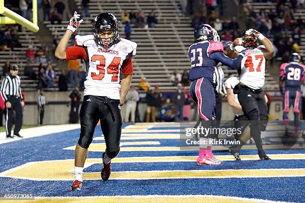 James Spencer of the Northern Illinois Huskies celebrates after scoring a touchdown against the Toledo Rockets during the fourth quarter on November...