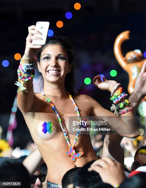 Fan watches a performance by Diplo during the 18th annual Electric Daisy Carnival at Las Vegas Motor Speedway on June 21, 2014 in Las Vegas, Nevada.