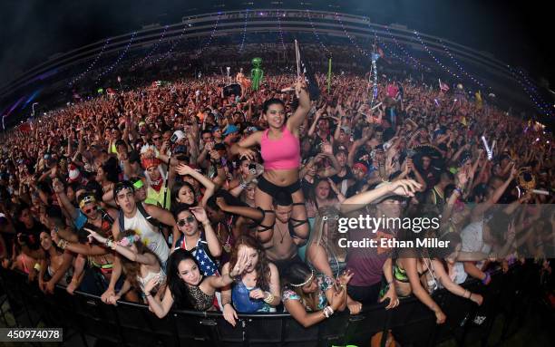 Fans react during a performance by Diplo at the 18th annual Electric Daisy Carnival at Las Vegas Motor Speedway on June 21, 2014 in Las Vegas, Nevada.