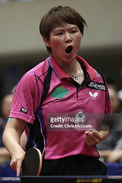 Chen Szu-Yu of Taipei celebrates a point against Yu Mengyu of Singapore during their Women's Singles Quarter final match on day two of 2014 ITTF...