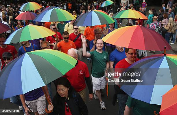 Members of the Seattle Men's Chrous of the USA participate in the annual Christopher Street Day parade on Kurfuerstendamm avenue on June 21, 2014 in...