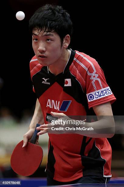 Yuto Muramatsu of Japan serves against Kang Dongsoo of Korea during their Men's Singles Quarter final match on day two of 2014 ITTF World Tour Japan...