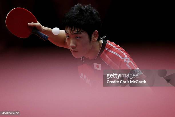 Yuto Muramatsu of Japan serves against Kang Dongsoo of Korea during their Men's Singles Quarter final match on day two of 2014 ITTF World Tour Japan...
