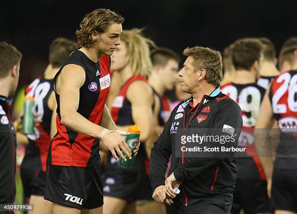 Bombers Head coach Mark Thompson talks with Joe Daniher during the round 14 AFL match between the Essendon Bombers and the Adelaide Crows at Etihad...