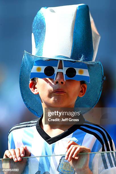 An Argentina fan enjoys the atmosphere prior to the 2014 FIFA World Cup Brazil Group F match between Argentina and Iran at Estadio Mineirao on June...