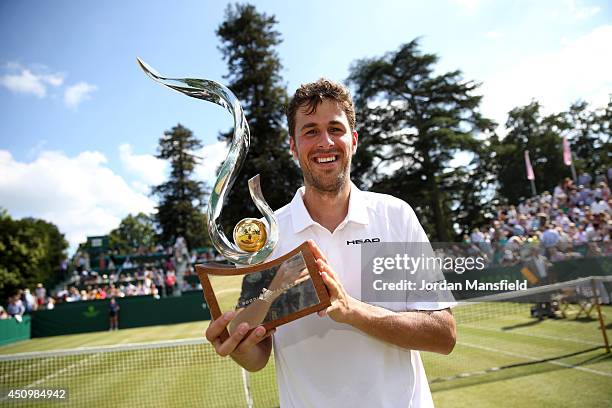 Robin Haase of the Netherlands holds the trophy after defeating Jan-Lennard Struff of Germany in the trophy match on day five of The Boodles Tennis...