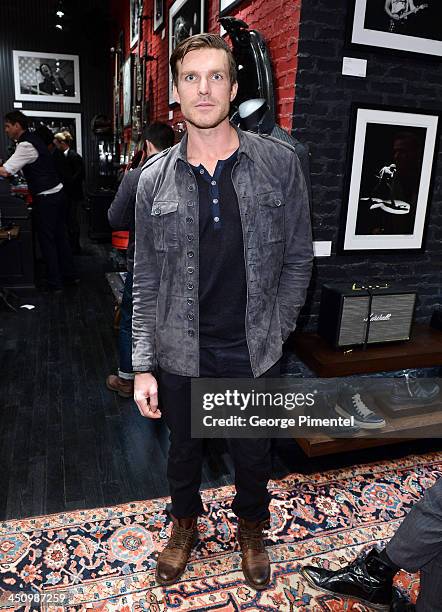 Toronto Maple Leaf Hockey player David Clarkson attends the opening of the new Toronto store and the launch of JOHN VARVATOS: ROCK IN FASHION Book at...