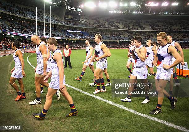 The Crows leave the field after losing the round 14 AFL match between the Essendon Bombers and the Adelaide Crows at Etihad Stadium on June 21, 2014...