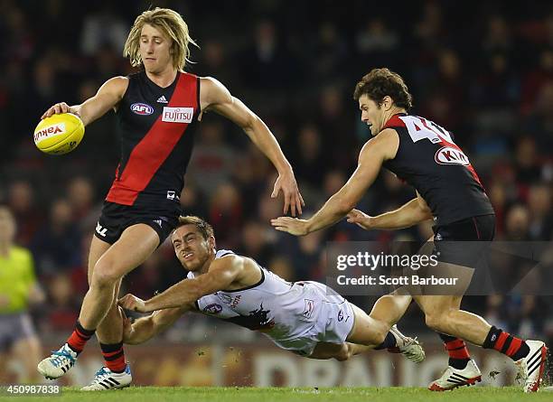 Dyson Heppell of the Bombers kicks the ball during the round 14 AFL match between the Essendon Bombers and the Adelaide Crows at Etihad Stadium on...