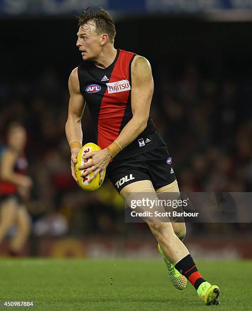 Brendon Goddard of the Bombers runs with the ball during the round 14 AFL match between the Essendon Bombers and the Adelaide Crows at Etihad Stadium...