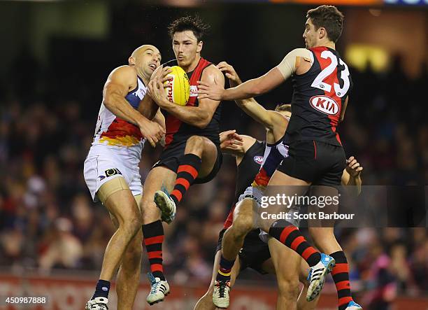 Michael Hibberd of the Bombers takes a mark during the round 14 AFL match between the Essendon Bombers and the Adelaide Crows at Etihad Stadium on...