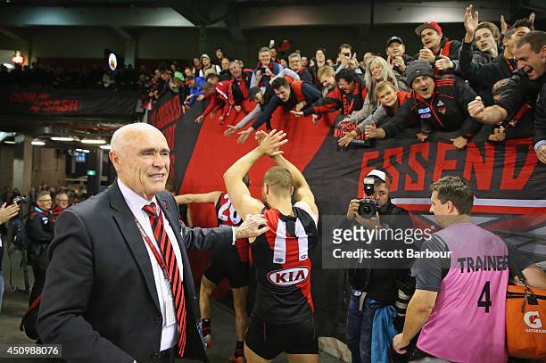 Bombers chairman Paul Little congratulates David Zaharakis of the Bombers as the Bombers make their way to the changing rooms after winning the round...