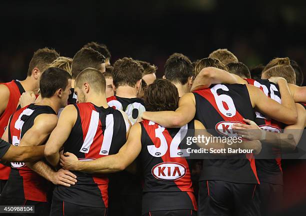 The Bombers form a huddle during the round 14 AFL match between the Essendon Bombers and the Adelaide Crows at Etihad Stadium on June 21, 2014 in...