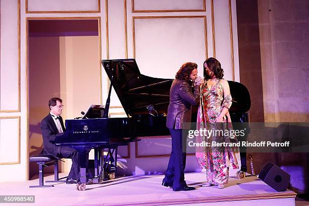 Roberto Alagna and his wife Aleksandra Kurzak perform during the L'Oreal Gala Evening 2014 at Chateau de Versailles on June 20, 2014 in Versailles,...