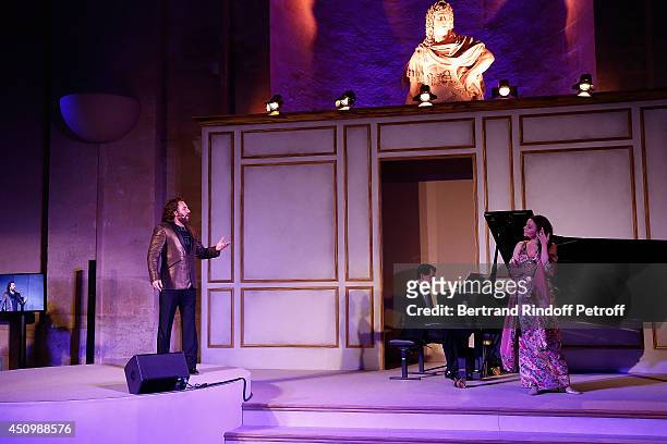 Roberto Alagna and his wife Aleksandra Kurzak perform during the L'Oreal Gala Evening 2014 at Chateau de Versailles on June 20, 2014 in Versailles,...