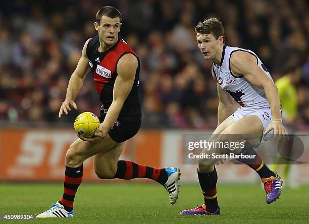 Brent Stanton of the Bombers runs with the ball during the round 14 AFL match between the Essendon Bombers and the Adelaide Crows at Etihad Stadium...