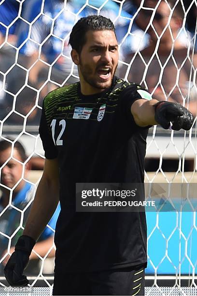 Iran's goalkeeper Alireza Haqiqi reacts during a Group F football match between Argentina and Iran at the Mineirao Stadium in Belo Horizonte during...