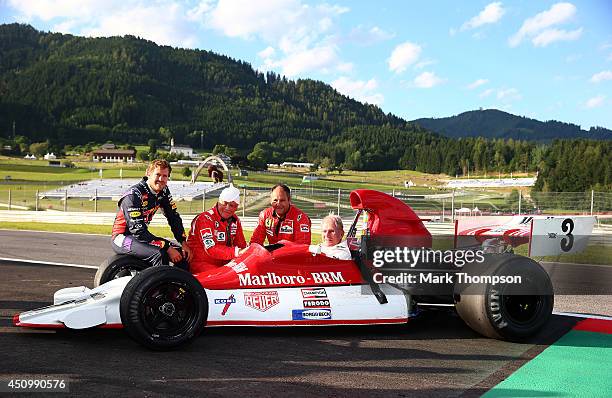 Dr Helmut Marko , consultant for Infiniti Red Bull Racing, sits in his car as he poses with Sebastian Vettel of Germany and Infiniti Red Bull Racing,...