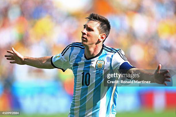 Lionel Messi of Argentina celebrates scoring his team's first goal during the 2014 FIFA World Cup Brazil Group F match between Argentina and Iran at...