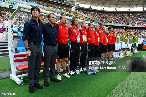 Head coach Joachim Loew of Germany, team staffs and substitute playres line up for the national anthems prior to the 2014 FIFA World Cup Brazil Group...