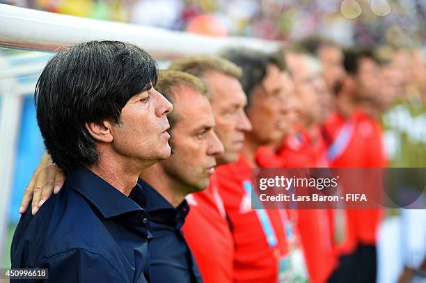 Head coach Joachim Loew of Germany, team staffs and substitute playres line up for the national anthems prior to the 2014 FIFA World Cup Brazil Group...