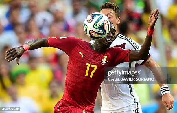 Ghana's midfielder Mohammed Rabiu vies with Germany's midfielder Mesut Ozil during a Group G football match between Germany and Ghana at the Castelao...