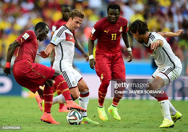 Ghana's midfielder Mohammed Rabiu vies with Germany's forward Mario Goetze during a Group G football match between Germany and Ghana at the Castelao...