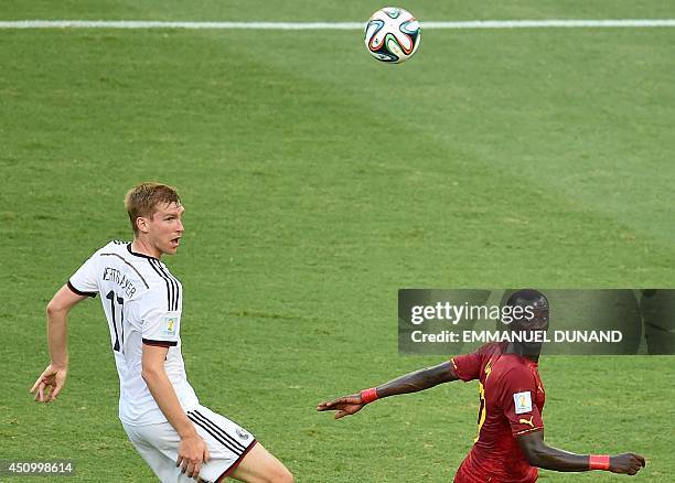 Germany's defender Per Mertesacker vies with Ghana's midfielder Mohammed Rabiu during a Group G football match between Germany and Ghana at the...