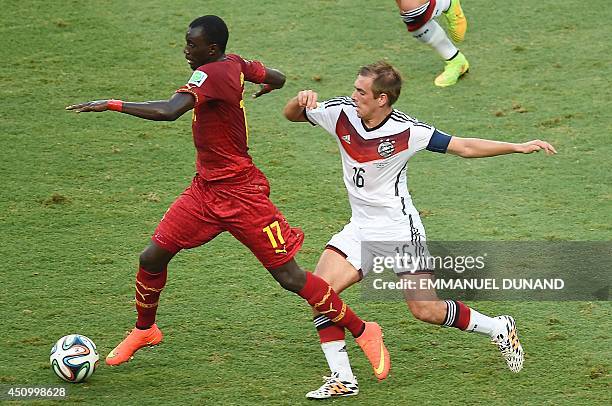 Ghana's midfielder Mohammed Rabiu vies with Germany's defender and captain Philipp Lahm during a Group G football match between Germany and Ghana at...