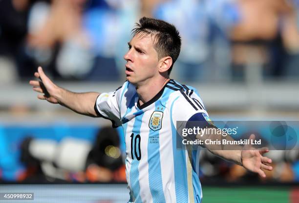 Lionel Messi of Argentina celebrates scoring the opening goal during the 2014 FIFA World Cup Brazil Group F match between Argentina and Iran at...