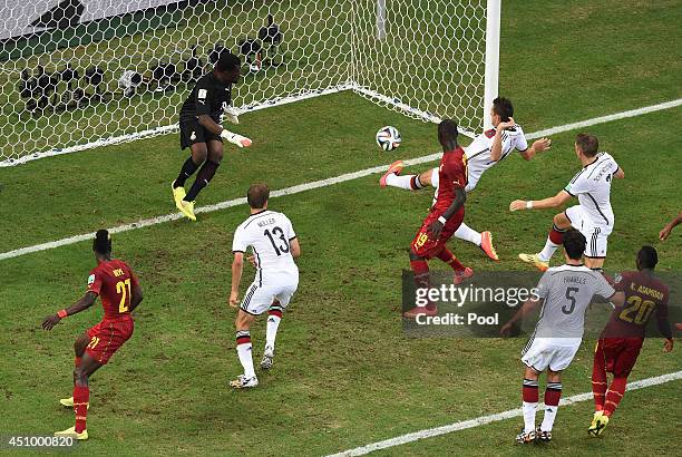 Miroslav Klose of Germany scores his team's second goal past Fatawu Dauda of Ghana during the 2014 FIFA World Cup Brazil Group G match between...