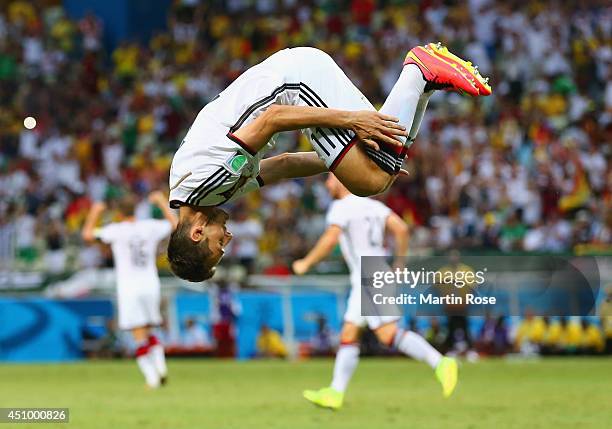 Miroslav Klose of Germany does a flip in celebration of scoring his team's second goal during the 2014 FIFA World Cup Brazil Group G match between...