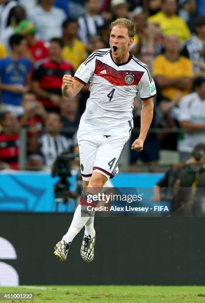 Benedikt Hoewedes of Germany celebrates assisting his team's second goal scored by Miroslav Klose during the 2014 FIFA World Cup Brazil Group G match...