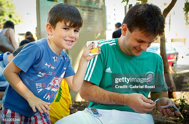 People gather at Praça Popular to swap Panini 2014 FIFA World Cup Brazil stickers on June 21, 2014 in Cuiaba, Brazil.