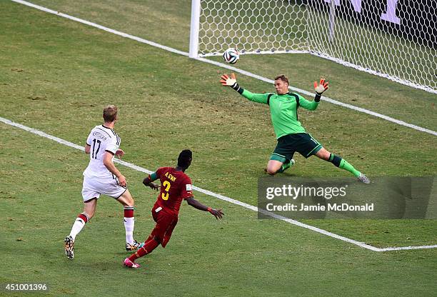 Asamoah Gyan of Ghana scores his team's second goal past Manuel Neuer of Germany during the 2014 FIFA World Cup Brazil Group G match between Germany...