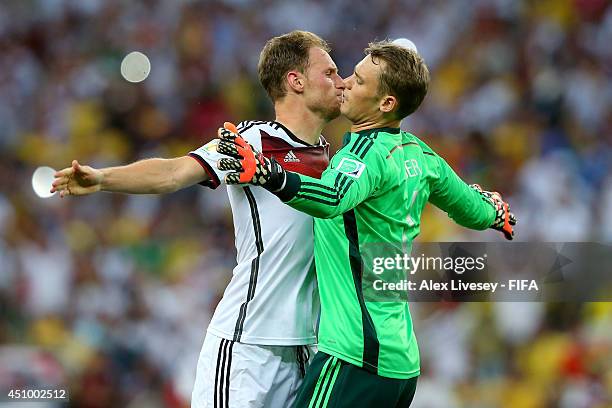 Benedikt Hoewedes of Germany celebates setting up his team's second goal with his teammate Manuel Neuer of Germany during the 2014 FIFA World Cup...