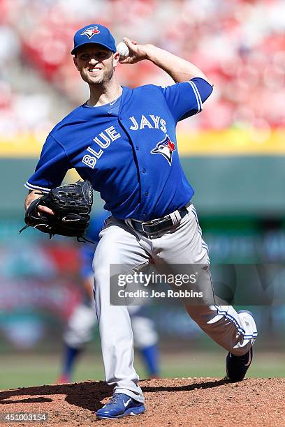 Happ of the Toronto Blue Jays pitches in the second inning of the game against the Cincinnati Reds at Great American Ball Park on June 21, 2014 in...