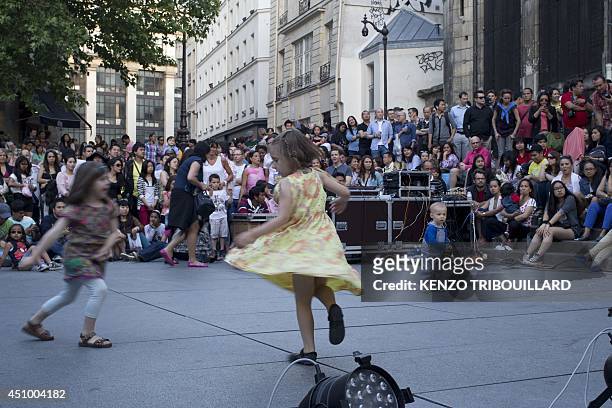 Children dance in Paris on June 21 as they take part in the annual music event '' La Fete de la Musique''. The event takes place across the streets...